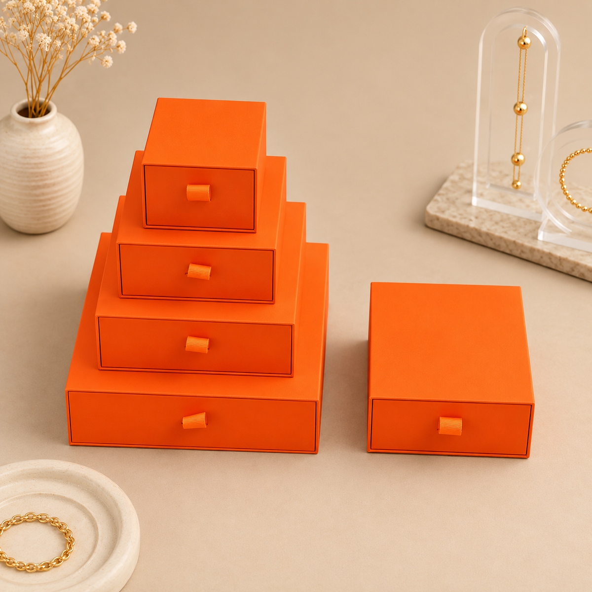 Orange paper drawer jewelry boxes in five sizes with ribbon pull tabs