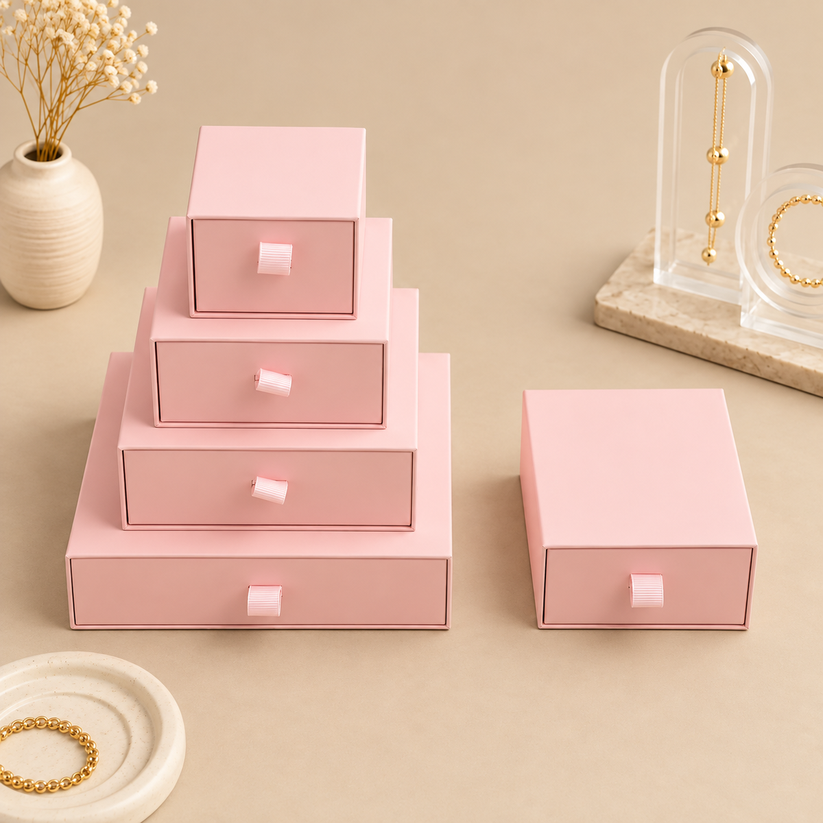 Pink paper drawer jewelry boxes in five sizes with ribbon pull tabs