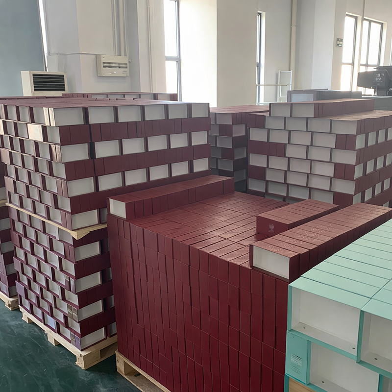 Semi-finished custom gift boxes stacked in production area - BespokeBoxCo manufacturing
