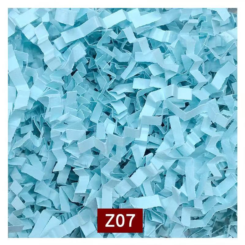 Soft shredded tissue paper cushioning for fragile item packaging