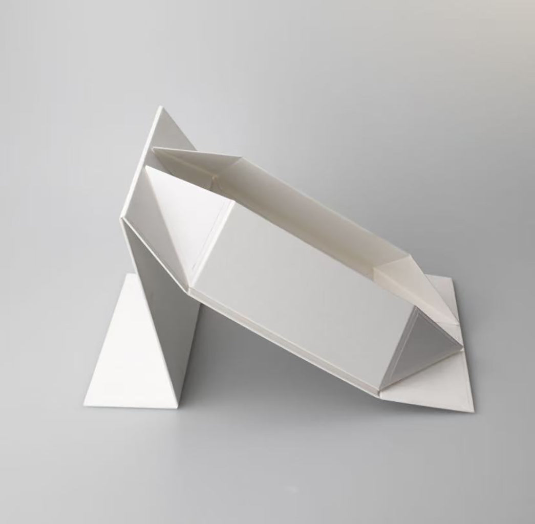 Flat-pack foldable gift box showing assembly process and final presentation