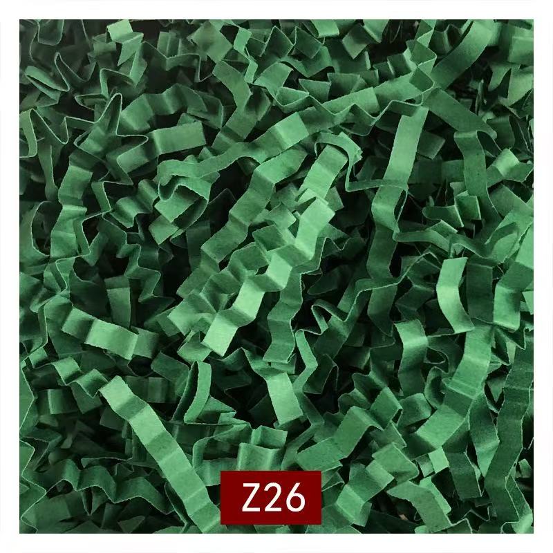 Decorative paper shred filler adding elegance to gift box presentation