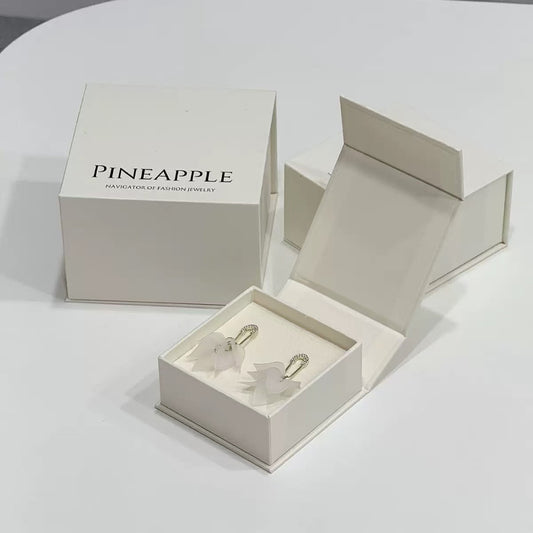 Open magnetic jewelry box showing velvet interior lining and cushion