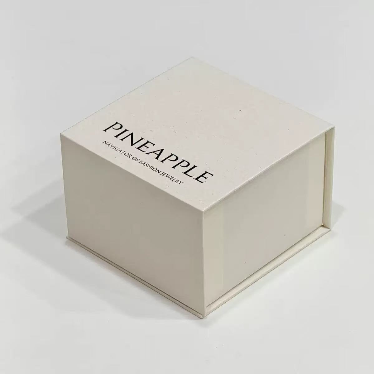 Open magnetic jewelry box showing velvet interior lining and cushion